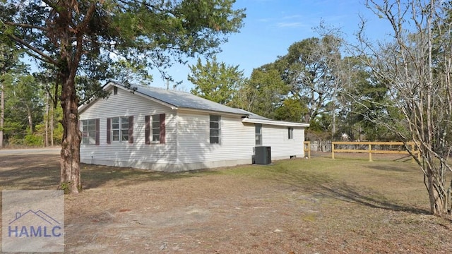 view of home's exterior with a lawn