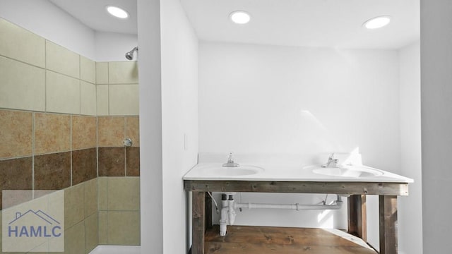 bathroom featuring a shower and sink