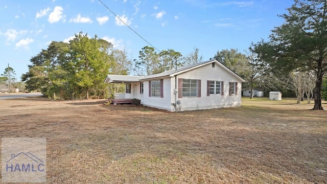 view of property exterior featuring a lawn