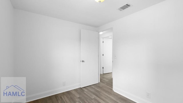 empty room with wood-type flooring