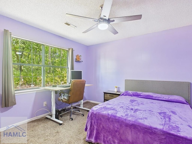 1336 Forest Lake Dr, Hinesville, GA 31313 - bedroom featuring baseboards, a textured ceiling, visible vents, ceiling fan, and carpet