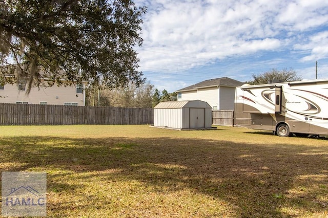 302 Largo Ct, Hinesville, GA 31313 - view of yard featuring a storage shed, an outbuilding, and a fenced backyard