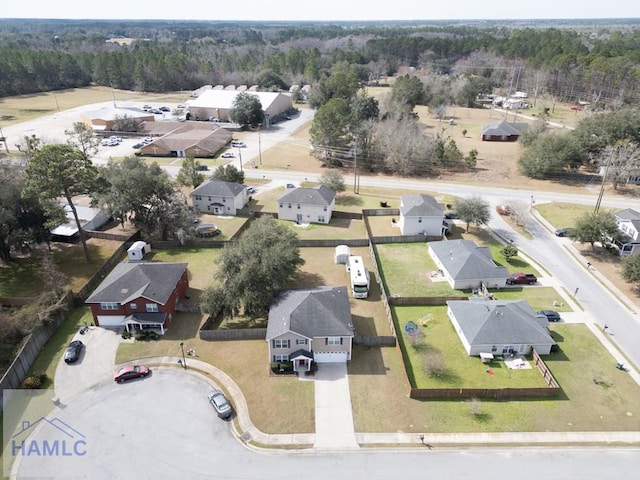 birds eye view of property with a residential view