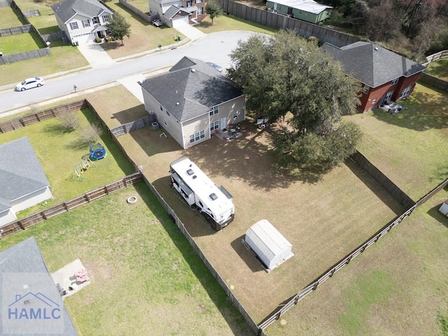 birds eye view of property with a residential view