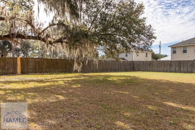 view of yard with fence