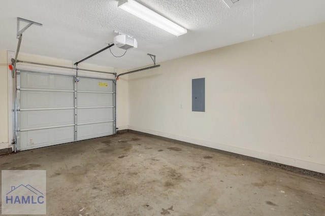 garage with a garage door opener and electric panel