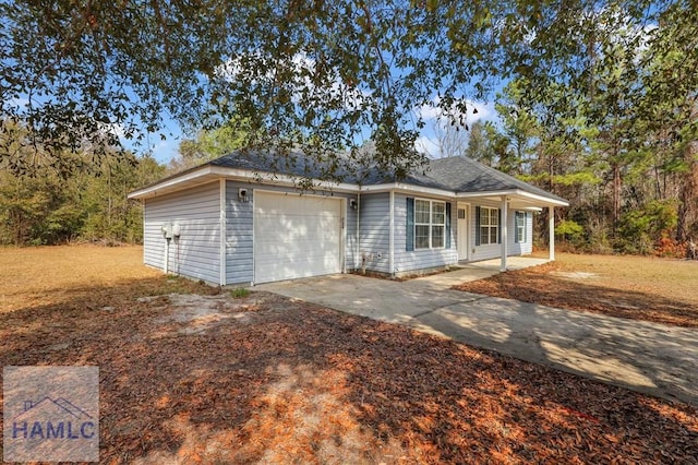 ranch-style home featuring a garage and covered porch