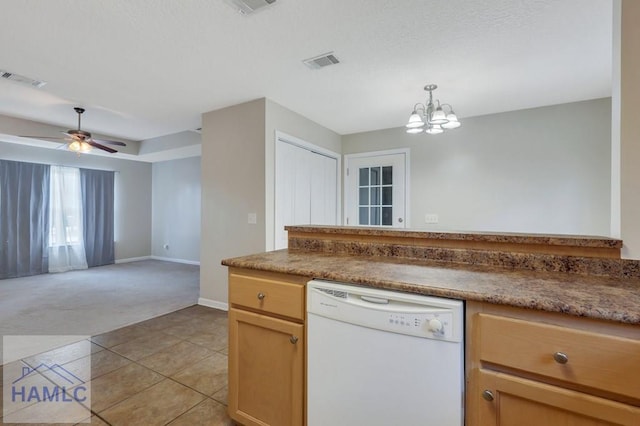 kitchen featuring white dishwasher, decorative light fixtures, ceiling fan with notable chandelier, and light tile patterned flooring