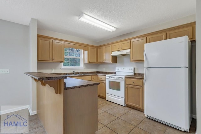 kitchen with white appliances, light brown cabinetry, kitchen peninsula, and a breakfast bar area