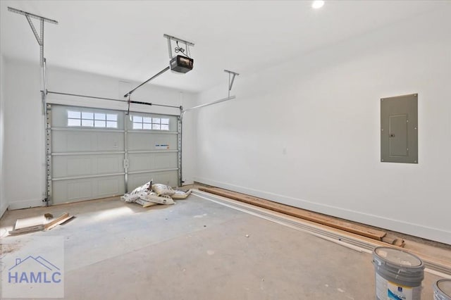 garage with electric panel, a garage door opener, and baseboards