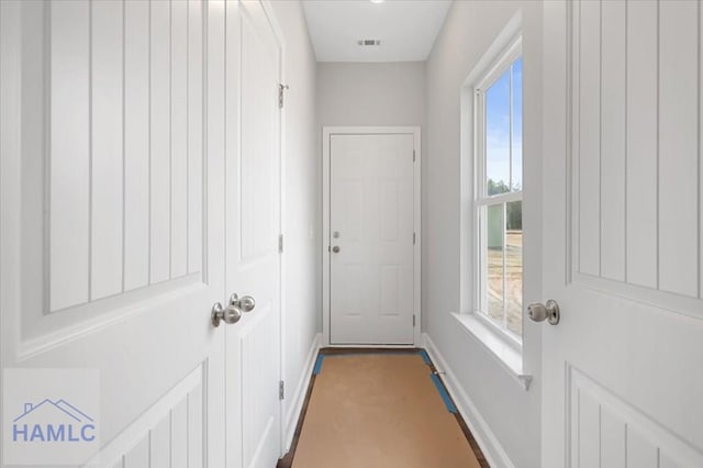 entryway with visible vents and baseboards