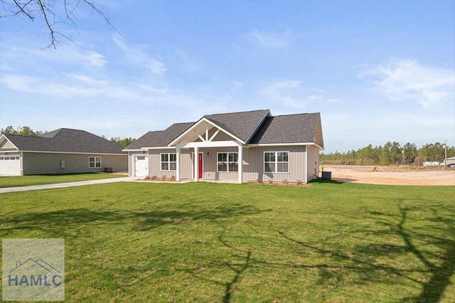 view of front facade featuring an attached garage, a front lawn, board and batten siding, and driveway