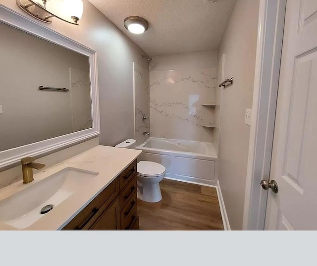 full bathroom featuring vanity, a textured ceiling, shower / tub combination, wood-type flooring, and toilet