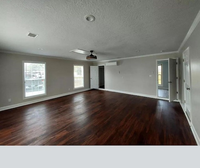 spare room featuring a wall mounted AC, ceiling fan, dark hardwood / wood-style floors, and ornamental molding