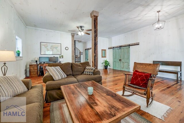 410 Green Morgan School Rd, Clyo, GA 31303 - living room featuring wood-type flooring, a barn door, and ceiling fan