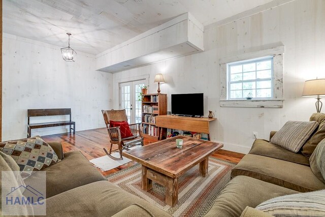 410 Green Morgan School Rd, Clyo, GA 31303 - living area featuring wood finished floors, plenty of natural light, french doors, and a chandelier
