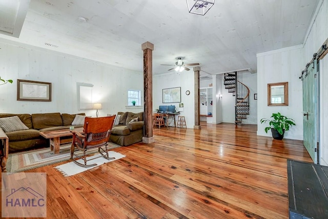 410 Green Morgan School Rd, Clyo, GA 31303 - living area featuring hardwood / wood-style floors, ceiling fan, stairs, and a barn door