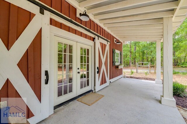 410 Green Morgan School Rd, Clyo, GA 31303 - view of exterior entry featuring board and batten siding and french doors