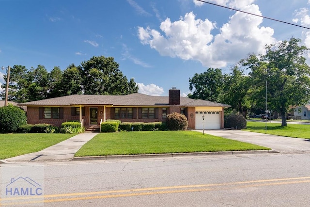 401E Smith St, Claxton, GA 30417 - ranch-style house featuring concrete driveway, brick siding, an attached garage, and a front lawn