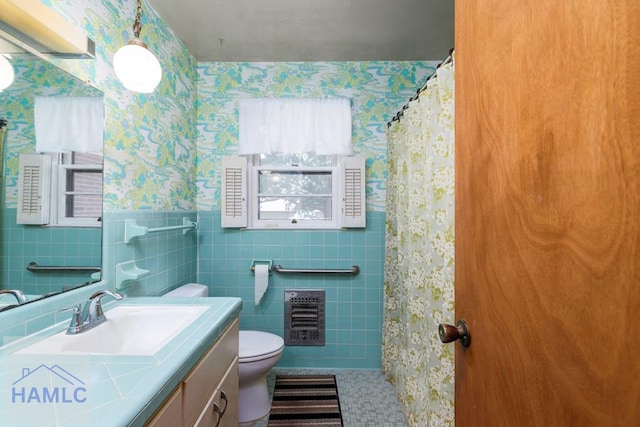 401E Smith St, Claxton, GA 30417 - bathroom with wallpapered walls, vanity, heating unit, tile walls, and a shower with curtain