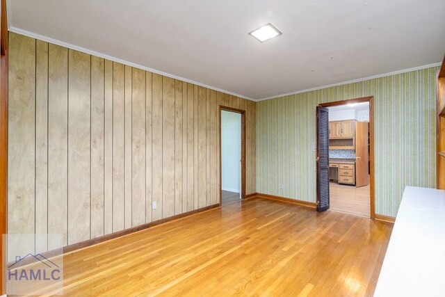 401E Smith St, Claxton, GA 30417 - spare room with wood finished floors and crown molding