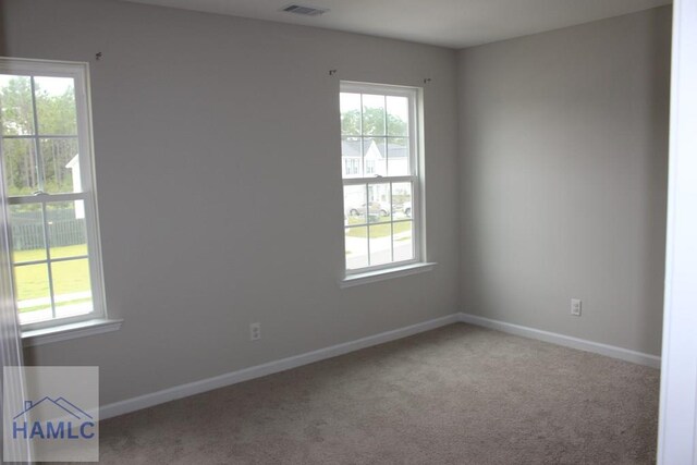 spare room featuring carpet flooring