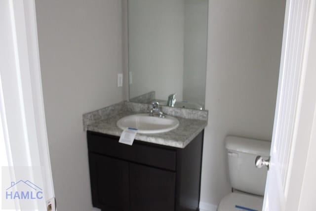 bathroom with vanity and toilet