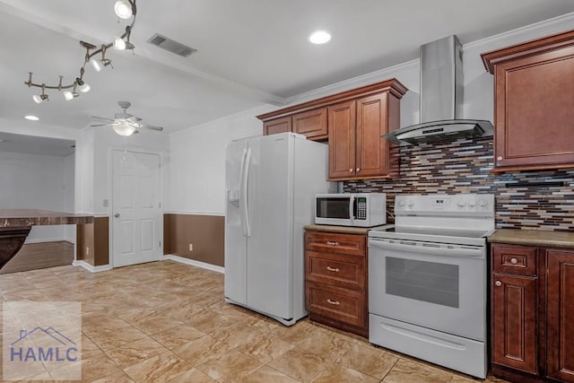 kitchen featuring white appliances, tasteful backsplash, visible vents, wall chimney exhaust hood, and ornamental molding