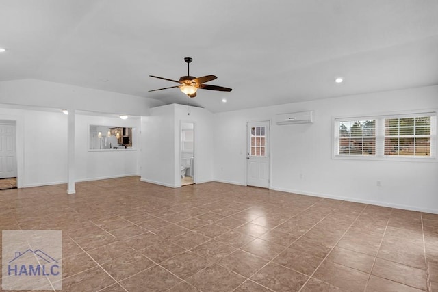 interior space featuring baseboards, a ceiling fan, a wall unit AC, vaulted ceiling, and recessed lighting