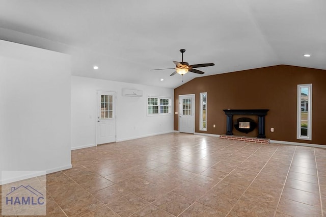 unfurnished living room with lofted ceiling, ceiling fan, a wall mounted AC, and a glass covered fireplace