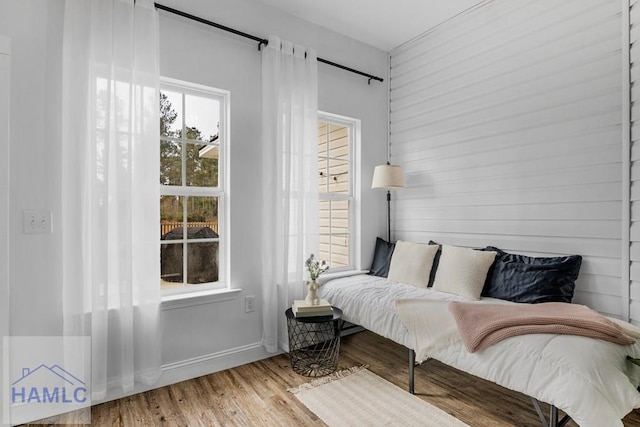 sitting room featuring a healthy amount of sunlight and wood finished floors