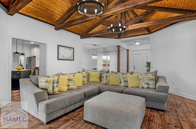 living room with baseboards, wood ceiling, wood finished floors, beamed ceiling, and ornate columns