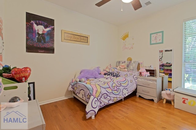 435 Arlington Dr, Hinesville, GA 31313 - bedroom with a ceiling fan, light wood-type flooring, multiple windows, and visible vents