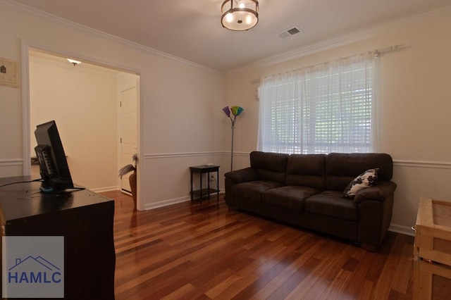 435 Arlington Dr, Hinesville, GA 31313 - living area with ornamental molding, visible vents, baseboards, and wood finished floors