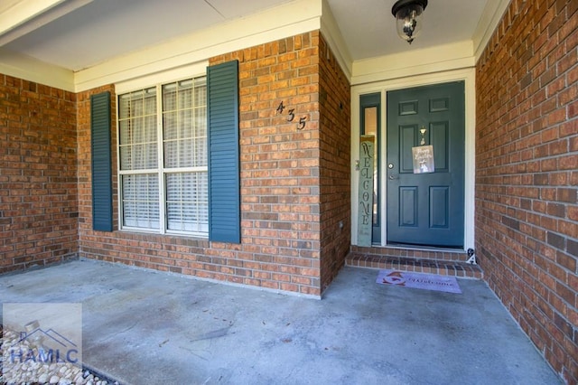 435 Arlington Dr, Hinesville, GA 31313 - property entrance with brick siding and a porch