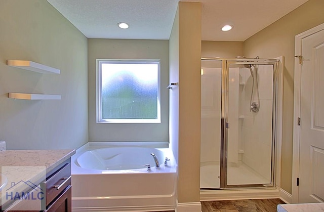 587 Fairview Cir, Hinesville, GA 31313 - full bathroom featuring a shower stall, a bath, and vanity