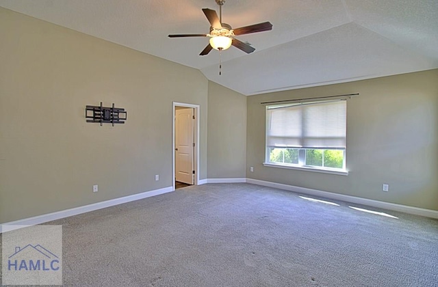 587 Fairview Cir, Hinesville, GA 31313 - carpeted empty room with vaulted ceiling, a ceiling fan, and baseboards