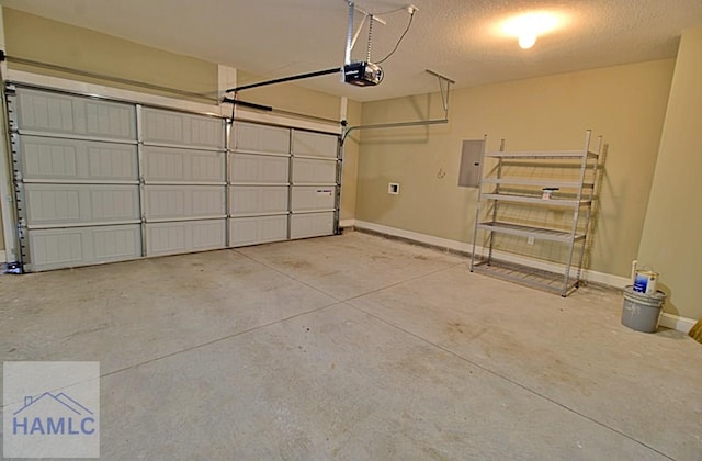 587 Fairview Cir, Hinesville, GA 31313 - garage with electric panel, a garage door opener, and baseboards