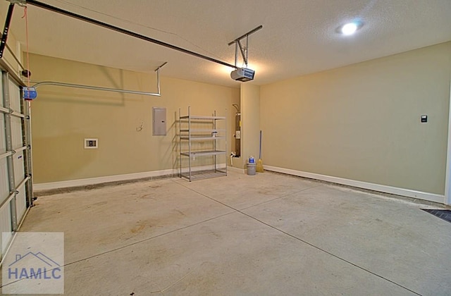 587 Fairview Cir, Hinesville, GA 31313 - garage with a garage door opener, electric panel, and baseboards