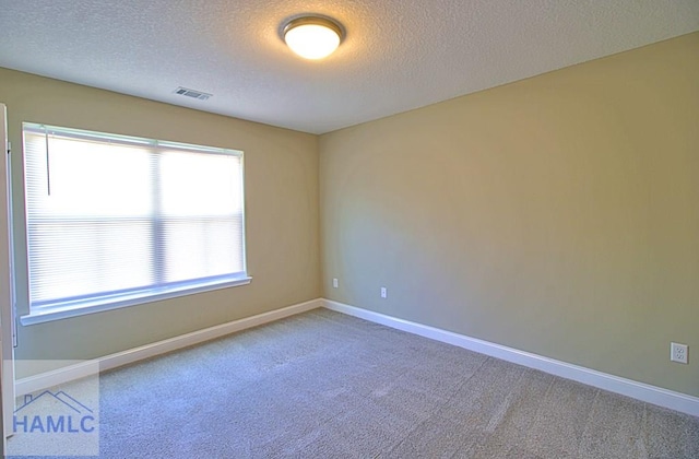 587 Fairview Cir, Hinesville, GA 31313 - empty room with a textured ceiling, carpet floors, and baseboards
