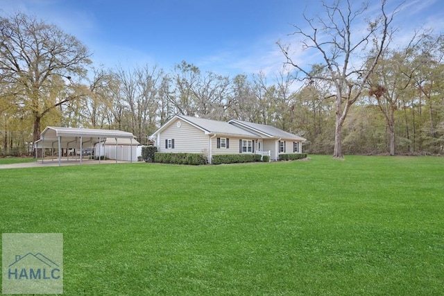 view of home's exterior with a detached carport and a lawn