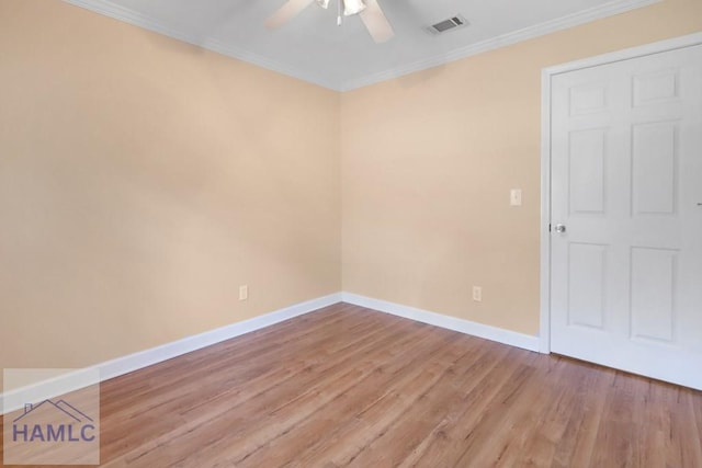 unfurnished room with light wood finished floors, ceiling fan, baseboards, and crown molding