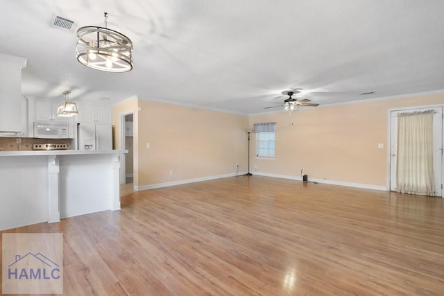 unfurnished living room with visible vents, crown molding, light wood finished floors, and ceiling fan with notable chandelier