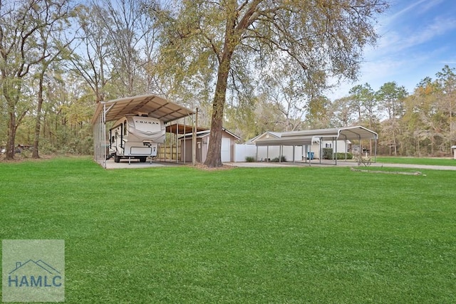 view of yard with a detached carport