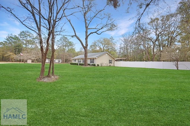 view of yard with fence