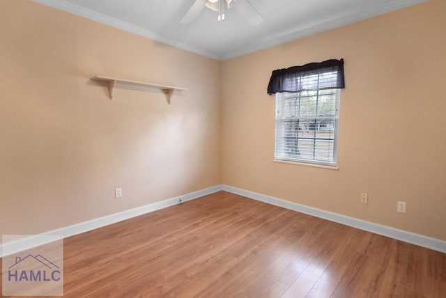 empty room featuring light wood-type flooring, baseboards, and a ceiling fan