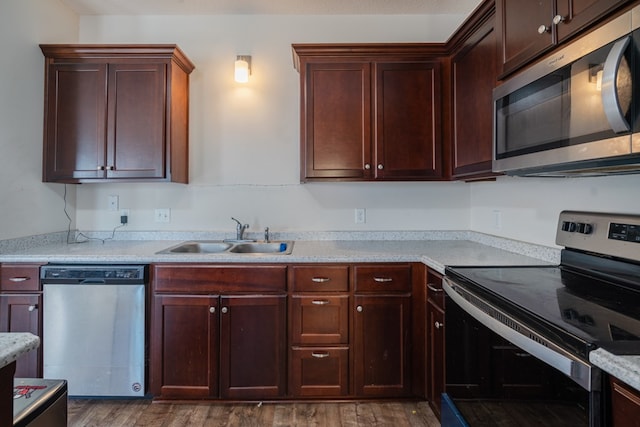 361 Thorp Cir, Hinesville, GA 31313 - kitchen with sink, stainless steel appliances, dark hardwood / wood-style floors, and light stone countertops