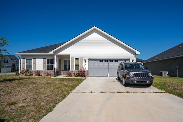 view of front of home with a garage, a front yard, and central air condition unit