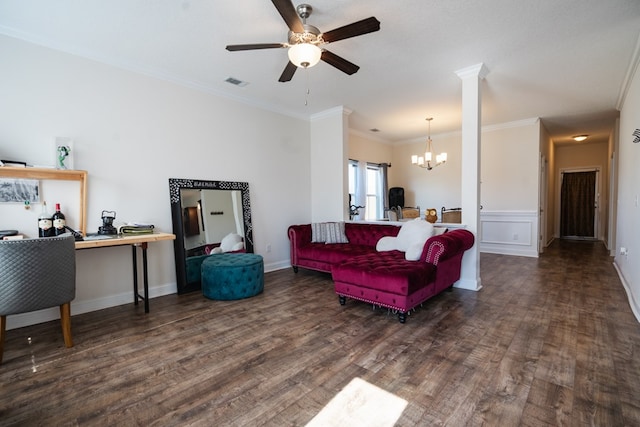 361 Thorp Cir, Hinesville, GA 31313 - living room with ornamental molding, dark hardwood / wood-style flooring, ceiling fan with notable chandelier, and decorative columns