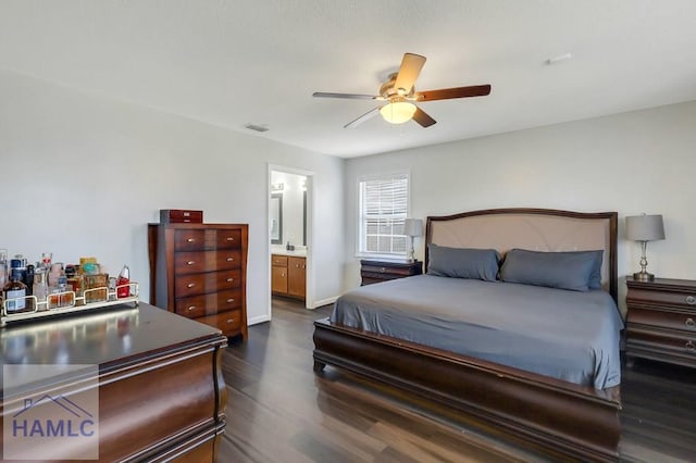 2014 Wimbledon Ct, Hinesville, GA 31313 - bedroom with dark wood-style floors, connected bathroom, a ceiling fan, and baseboards